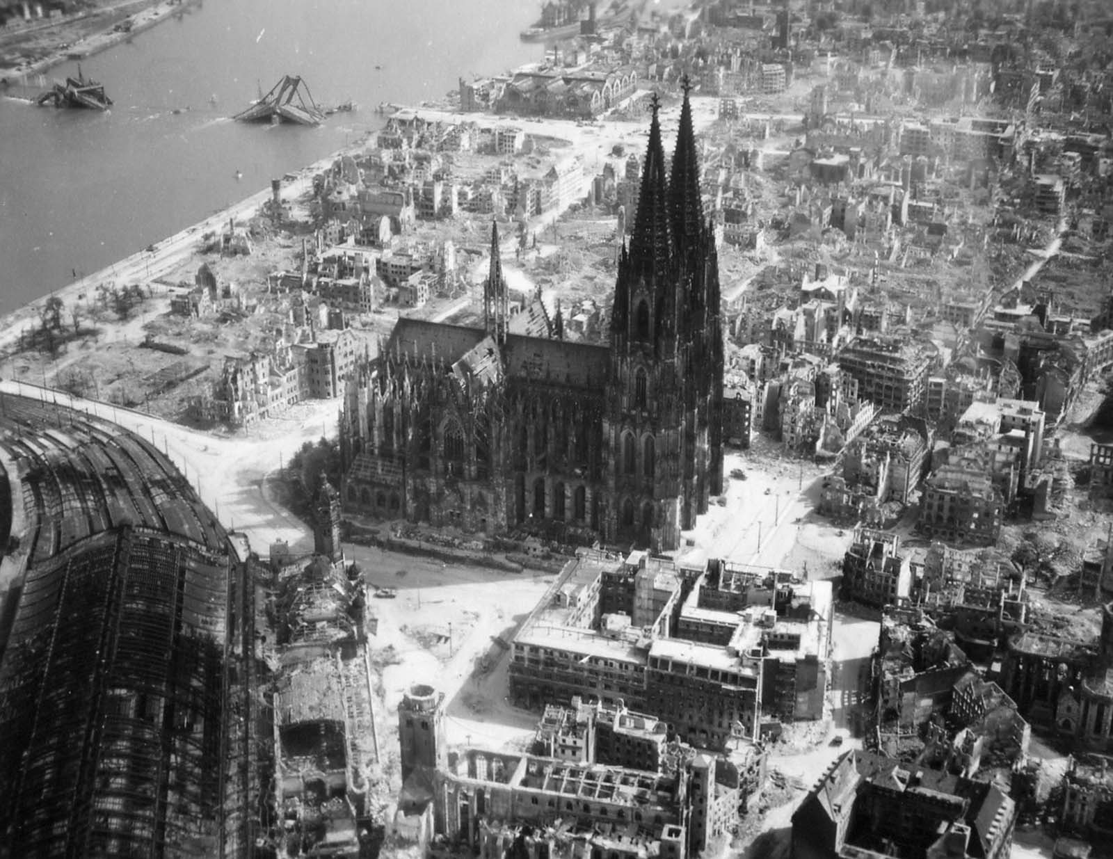 Cologne Cathedral Remains Standing Tall Amidst The Wreckage Left By Allied Bombings In 1944